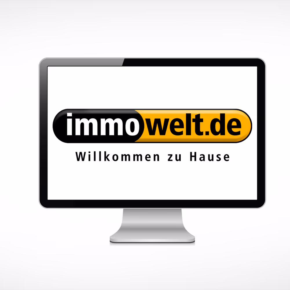 Computerbildschirm mit immowelt.de Logo und dem Text 'Willkommen zu Hause'.