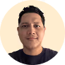 A man in a black shirt is looking at the camera.