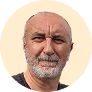 A man with a beard and a balding head.