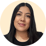 A woman with long black hair wearing a black shirt.