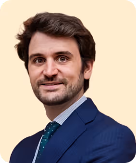 A man in a blue suit and tie.