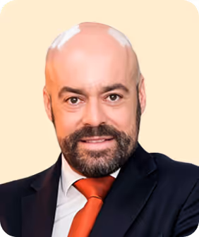 A man with a bald head wearing a suit and tie.