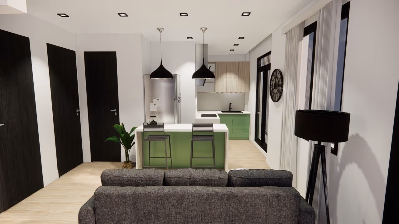Cocina moderna con isla verde, lámparas colgantes negras y sofá gris