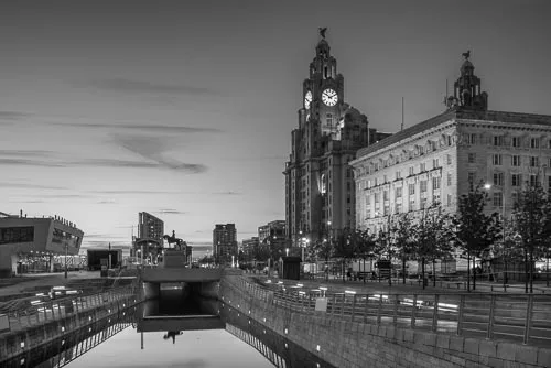 The Three Graces on Liverpool's Pier Head in black and white.