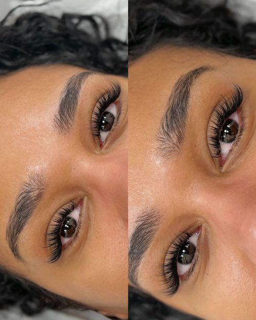 Close-up of a woman's eyes with long, thick eyelash extensions and well-groomed eyebrows.