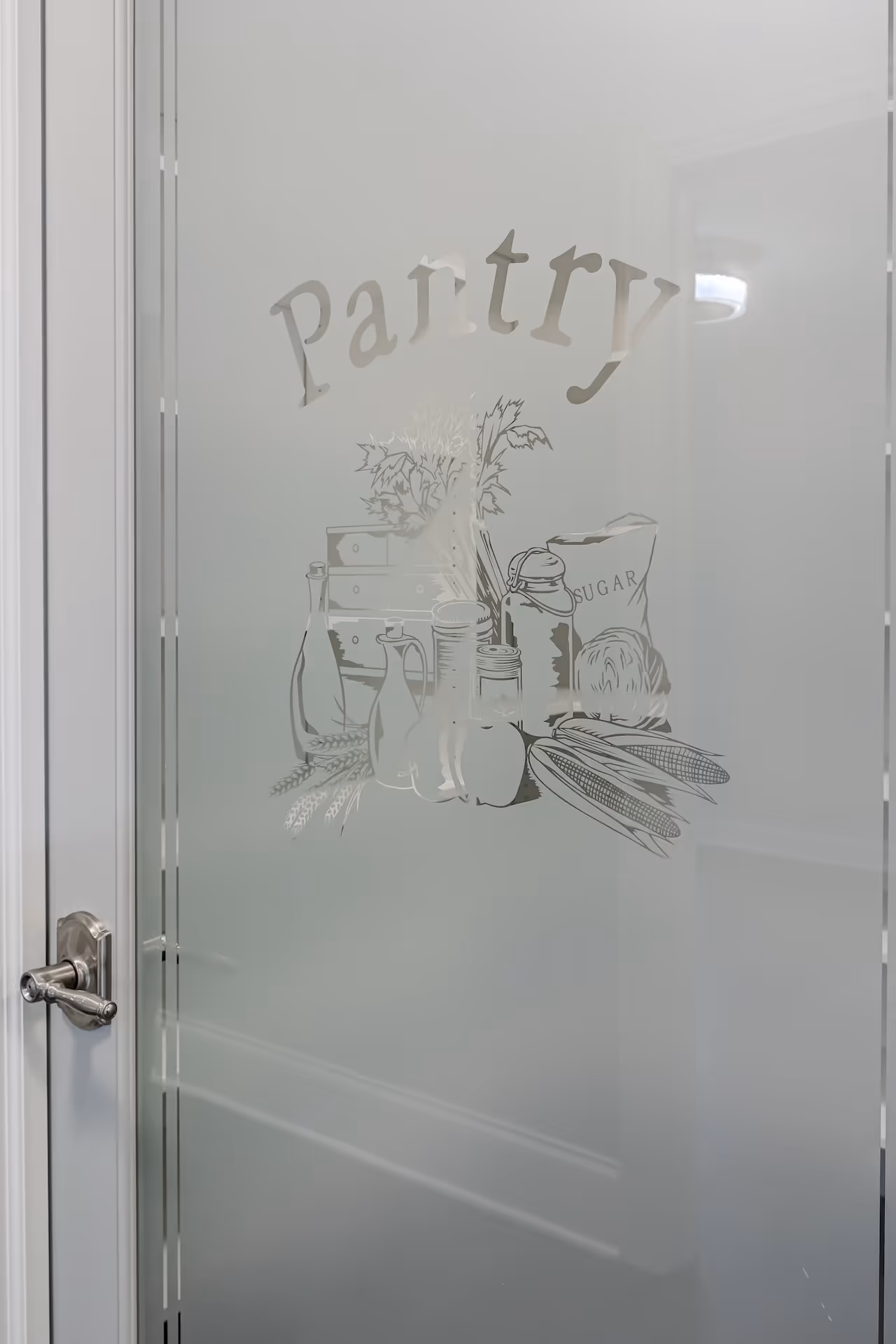 Frosted glass pantry door with illustration of food items including jars, a sugar bag, corn, and vegetables.