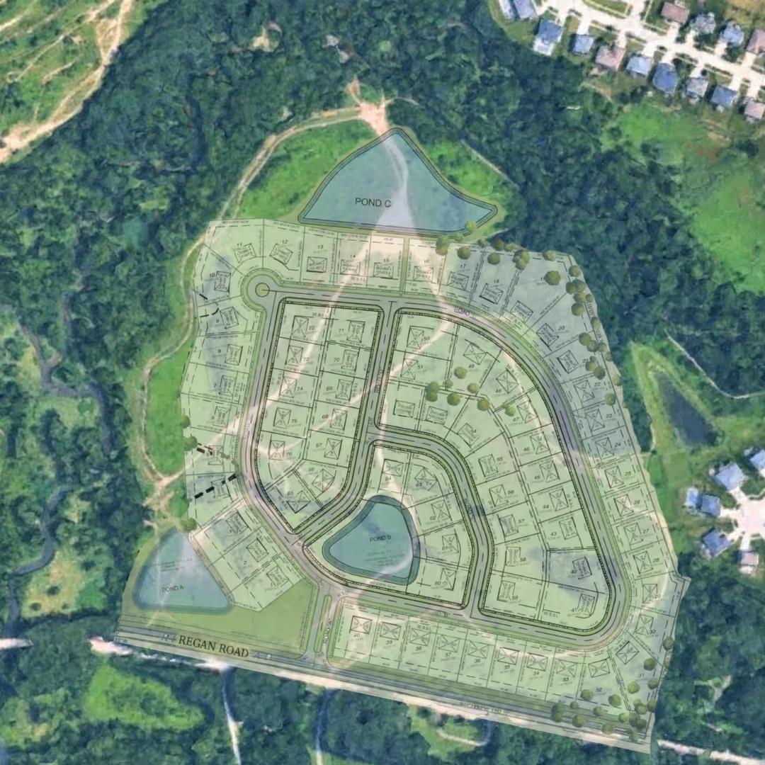 Aerial view of a residential development plan overlaid on a forested area, showing house plots, roads, and three labeled ponds near Regan Road.