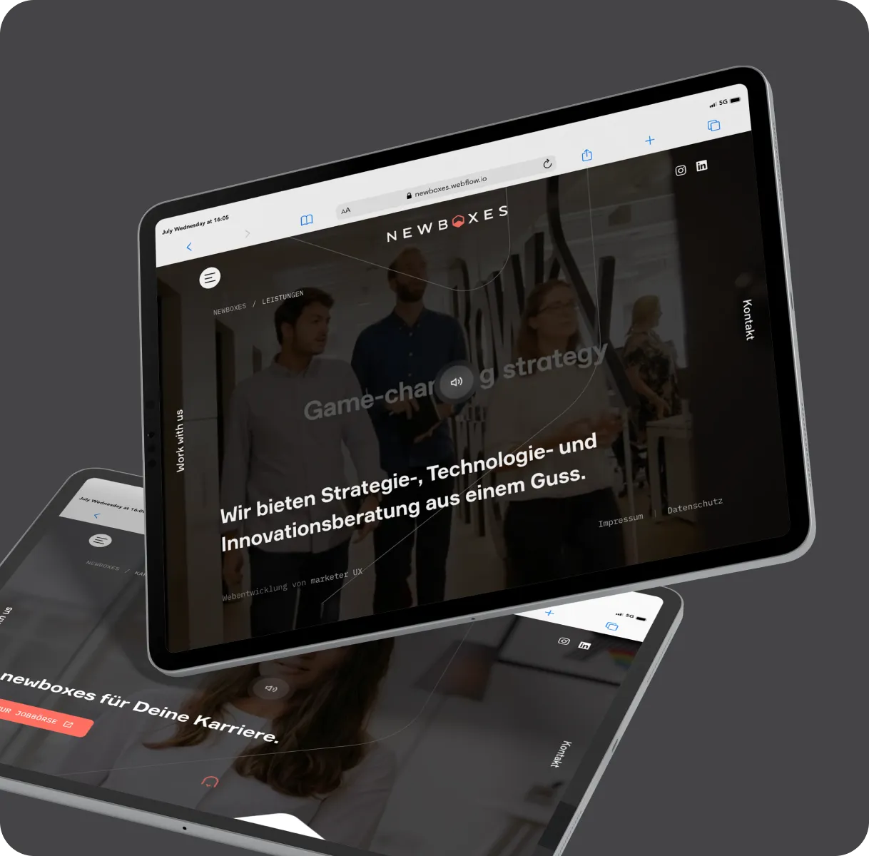 Two tablets showing the Newboxes website for strategy, technology and innovation consulting.