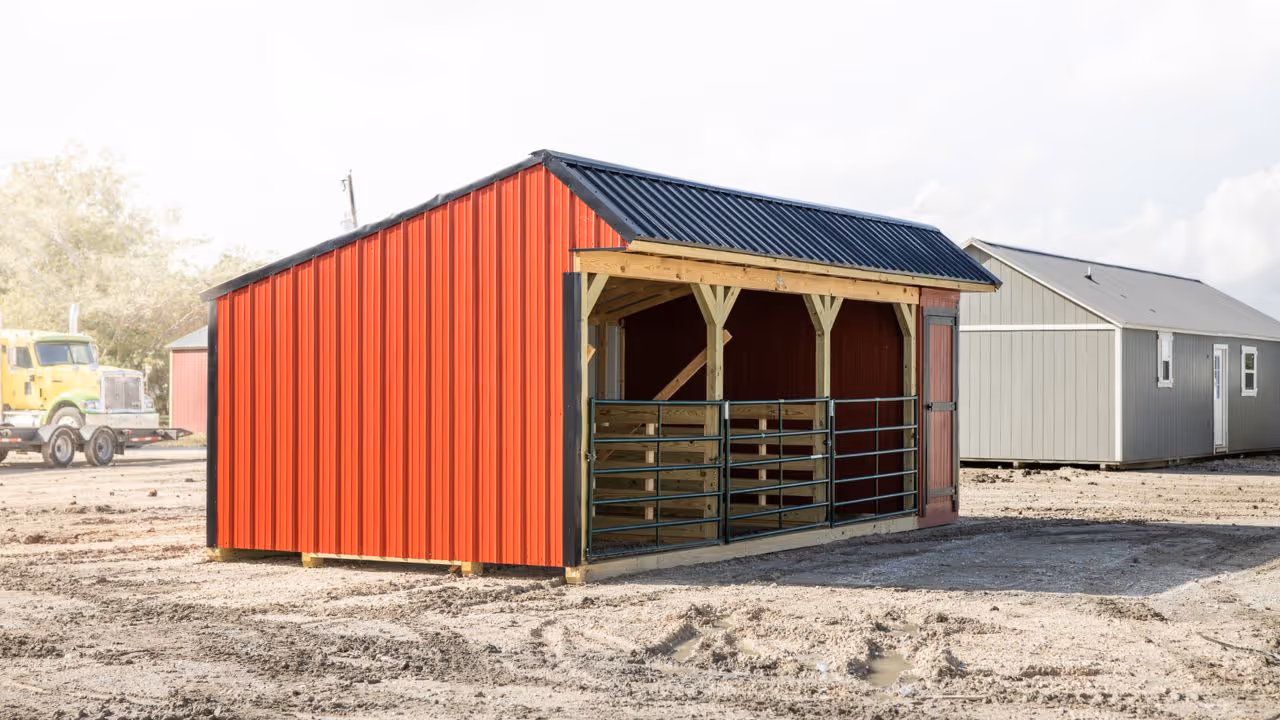 Person moving a shed using a shed mule