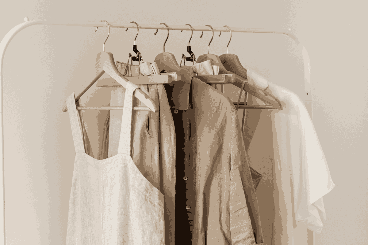 clothing rack with linen pieces hung