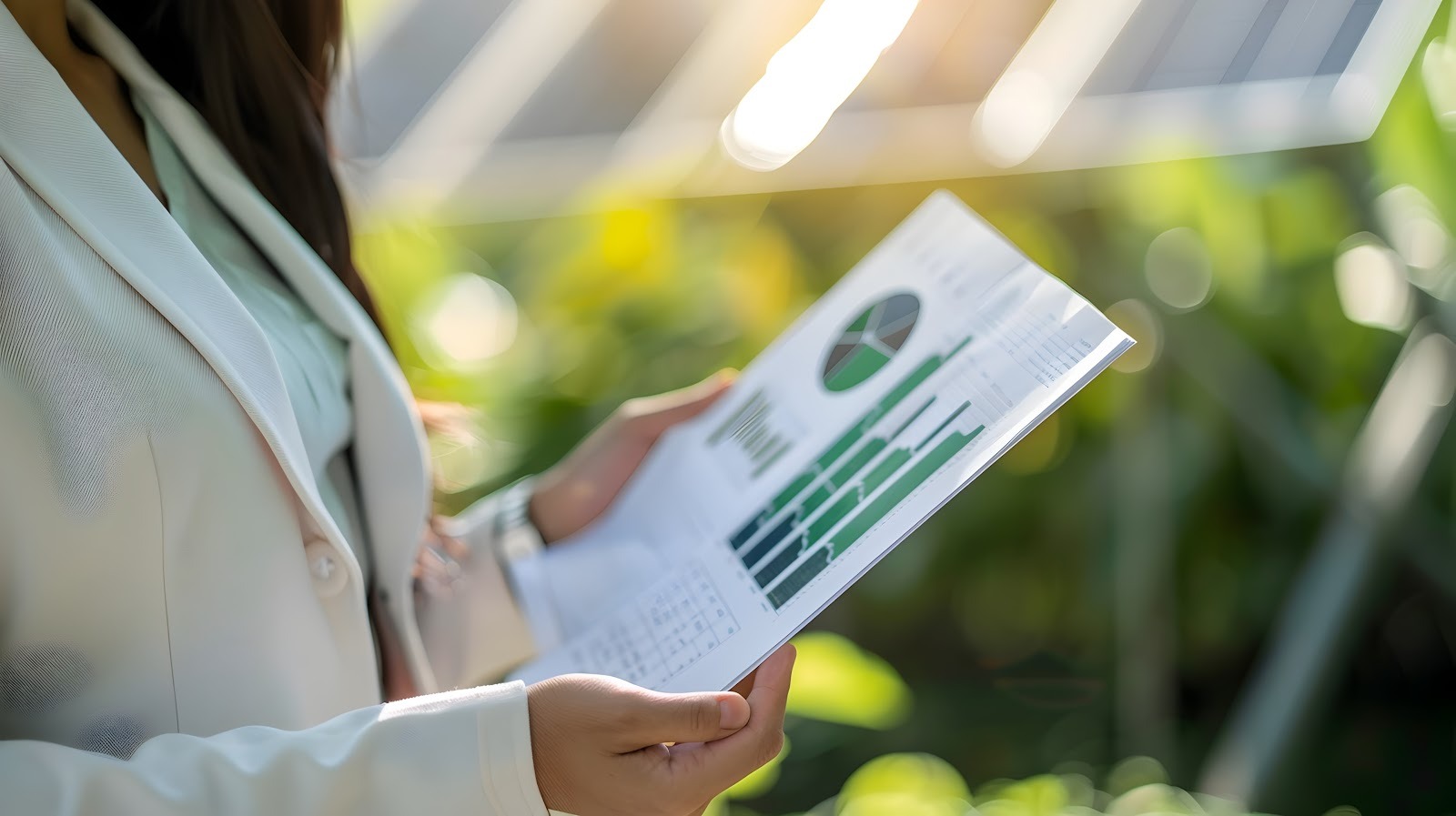 Businesswoman holding a climate report
