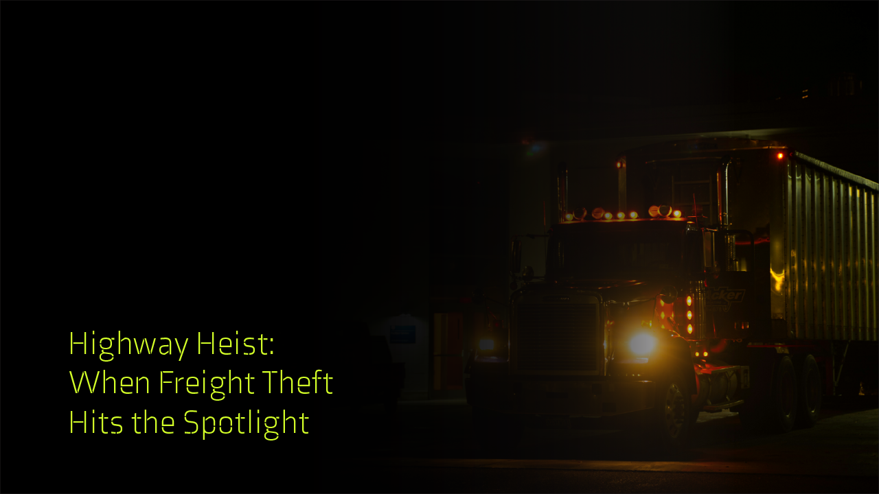 A semi truck with headlights on at night, in a dimly lit environment.