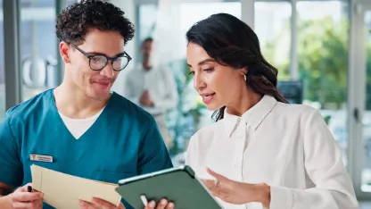 Doctors Discussing Advances in the Transmission of Radiographic Images