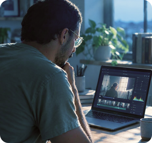 Post-production operator reviewing footage at an editing workstation