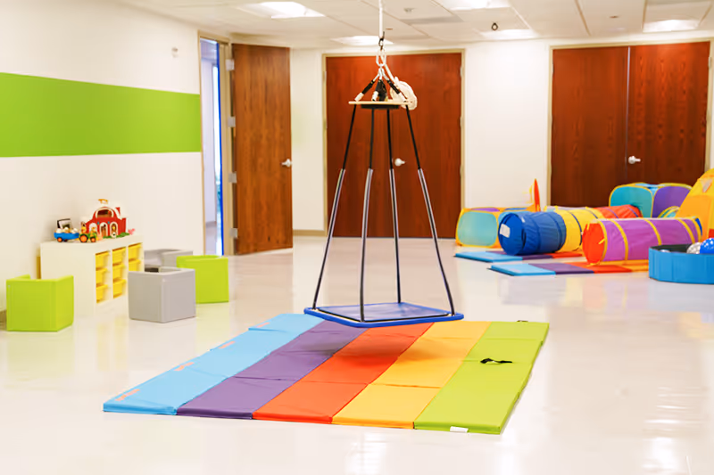 Dynamic gym space equipped with therapy tools to promote strength and coordination at North Shore Pediatric Therapy, Arlington Heights.