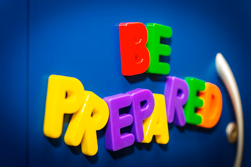 Magnetic letters on a locker that spell the words "Be Prepared."
