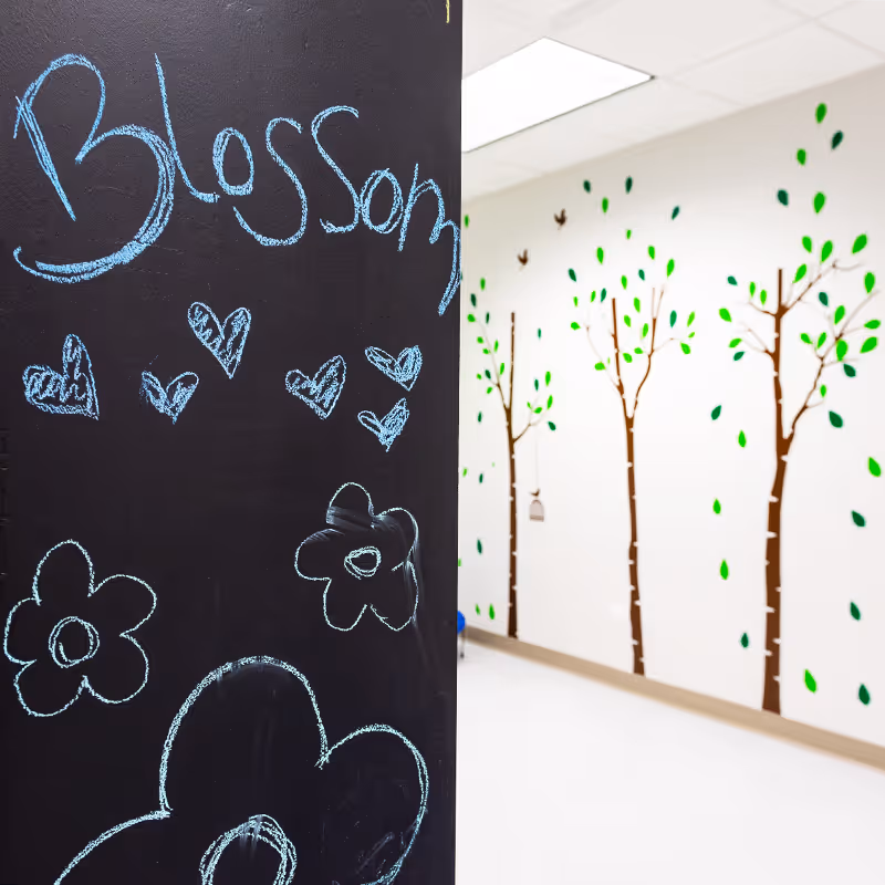 Vibrant play area with a chalkboard in Deerfield, IL at North Shore Pediatric Therapy.