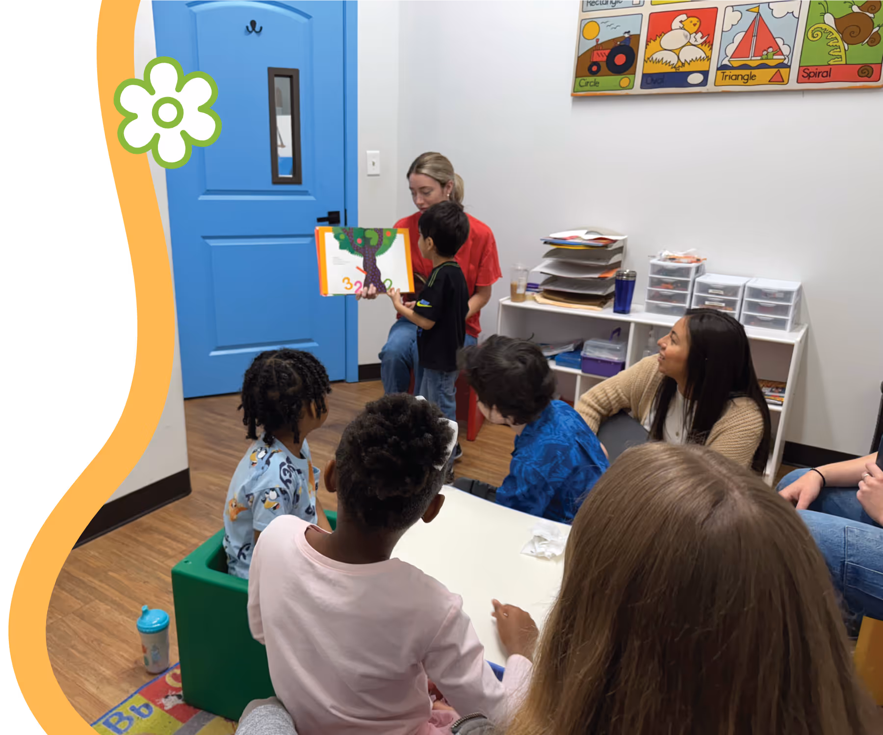 A therapist leading group reading activities in the Blossom Prep classroom