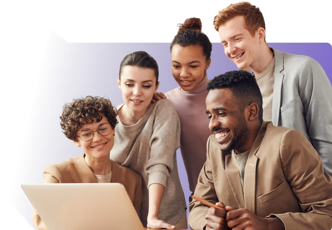 Group of five diverse young professionals gathered around a laptop, smiling and collaborating.