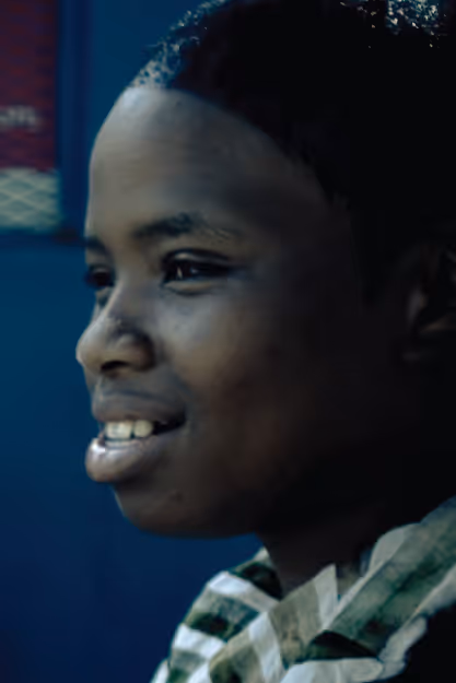 a young woman smiles and looks left