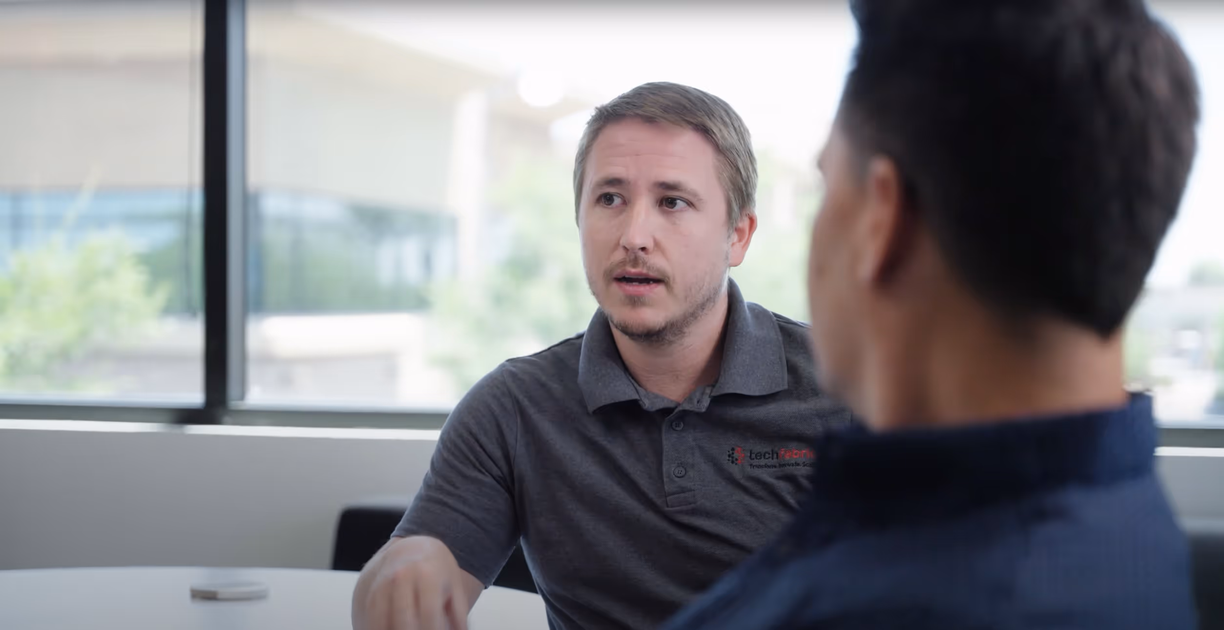 Tyler and Sam working on a solution