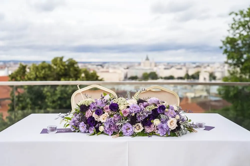 A romantic table for the newlyweds with live flowers and a magnificent view of St. Stephen's Basilica in the background.