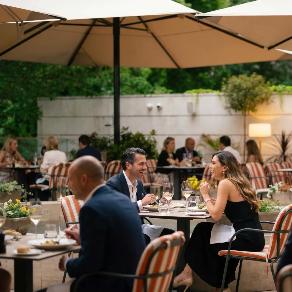 A couple is having dinner on the Aranybástya terrace of the Aranybástya under the umbrellas