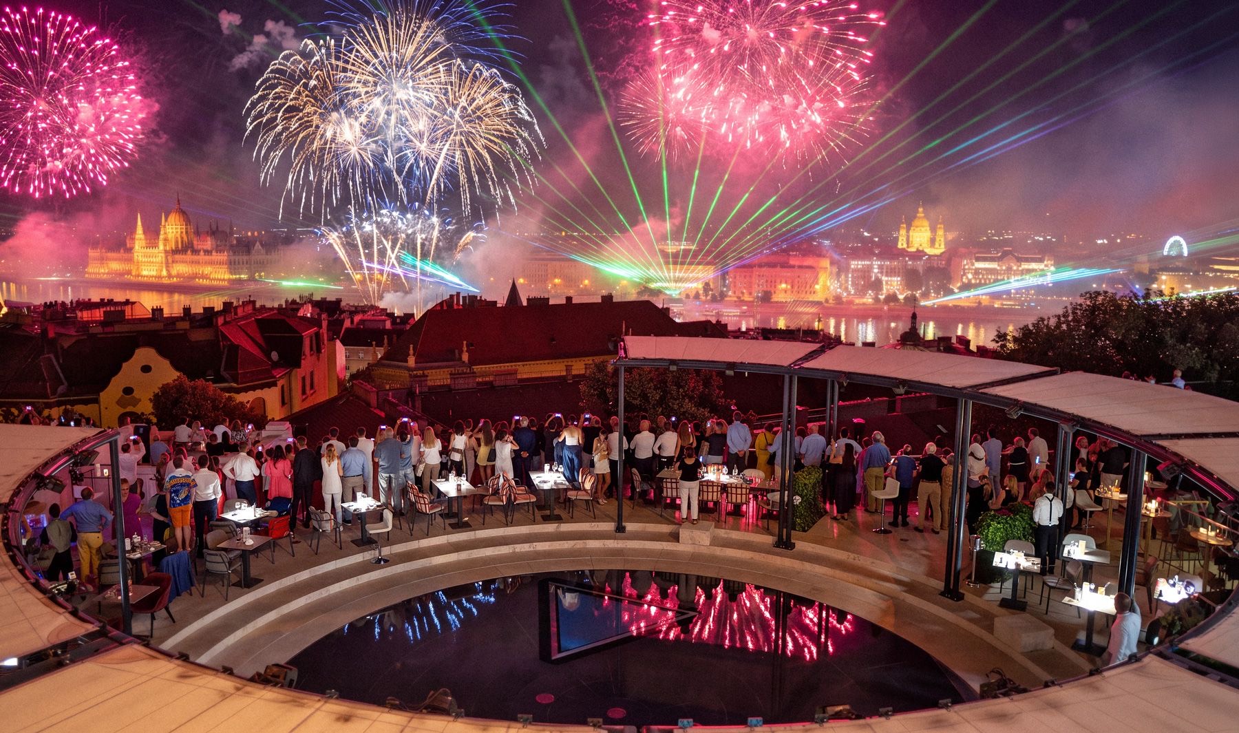 Fireworks and a laser show over the Danube, with a view of the Parliament Building from the terrace of the Aranybástya on August 20