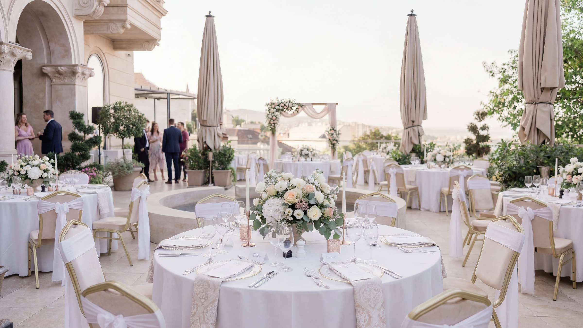 Wedding dinner with round tables set up on the terrace of Aranybástya
