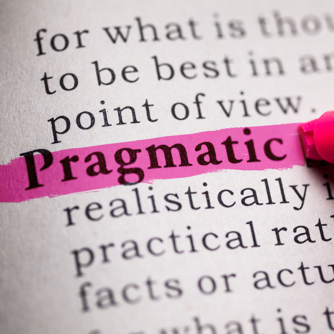 Close-up of a dictionary page with the word “Pragmatic” highlighted in pink.