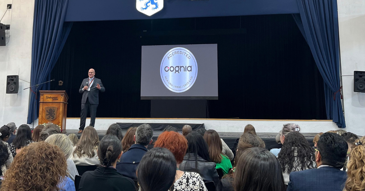 Cognia accreditation conference with educators learning about international standards, educational quality, and continuous improvement.