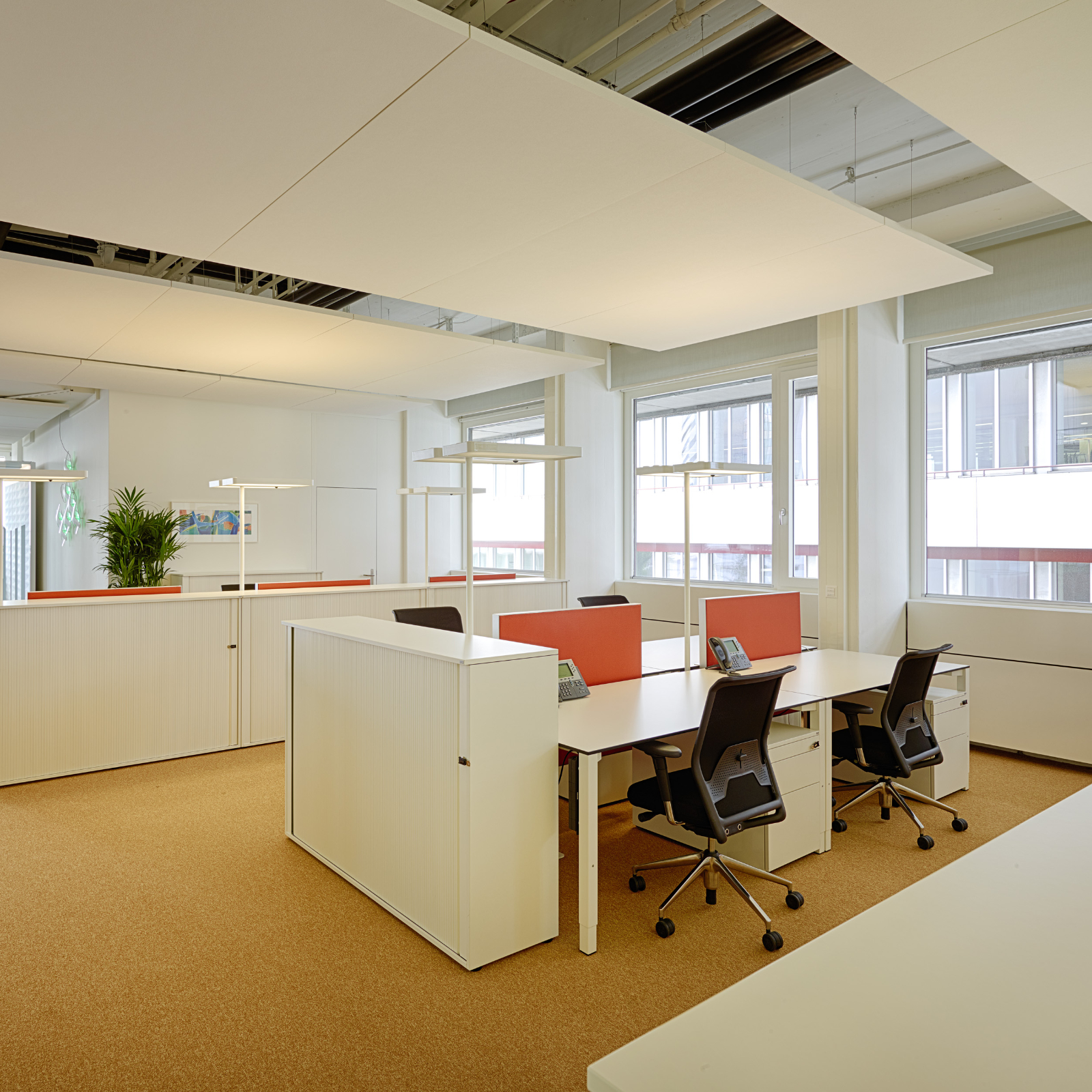 Installation of a multi-space office in a square floor plan with a formerly dark centre zone.