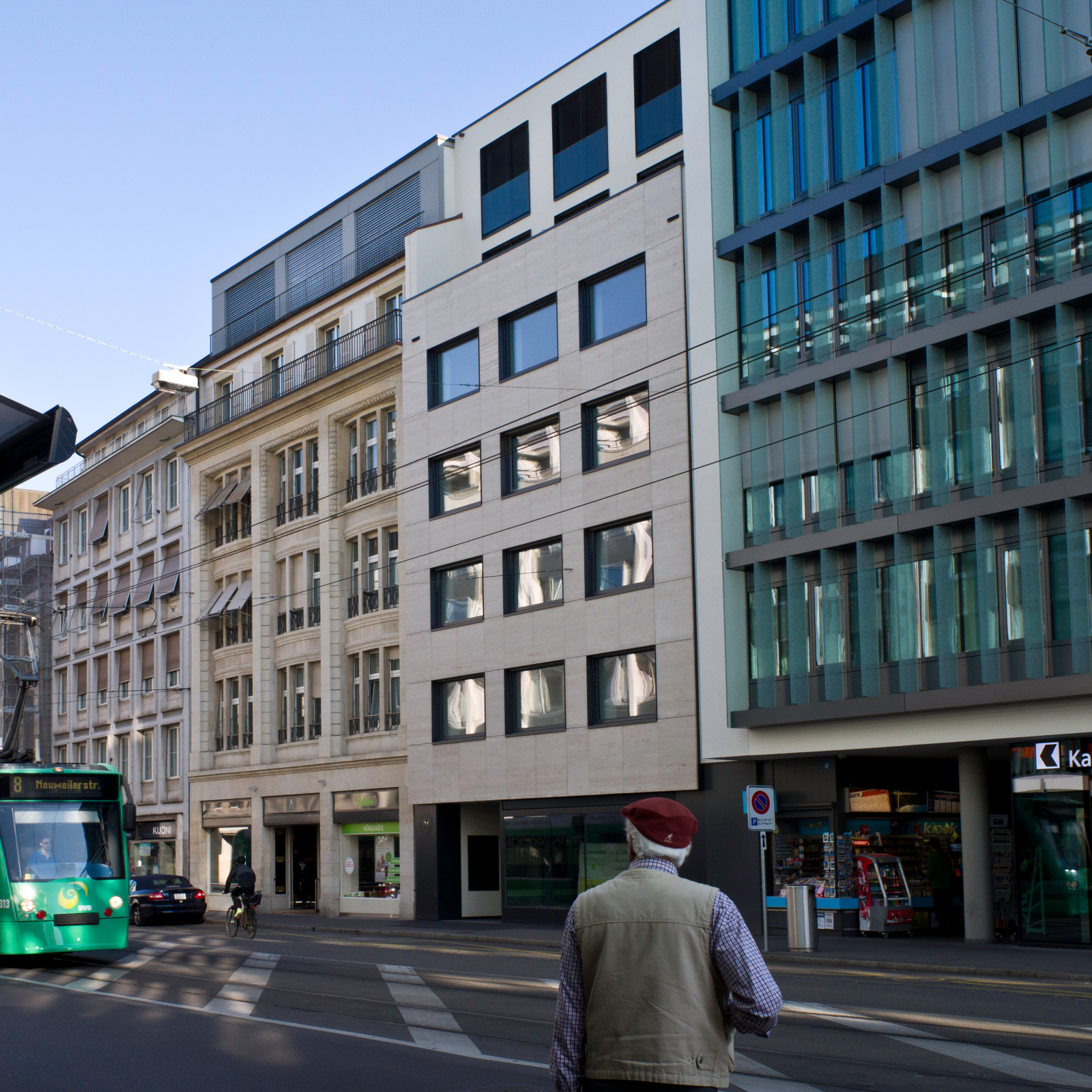 Refurbishment of a commercial building in a central location in Basel with extension of use to a residential and commercial building.