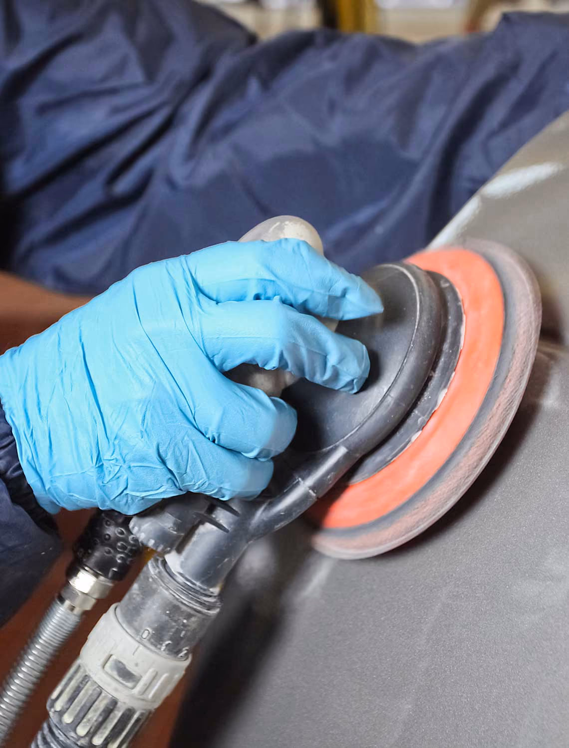 Man using car polisher without havs monitoring