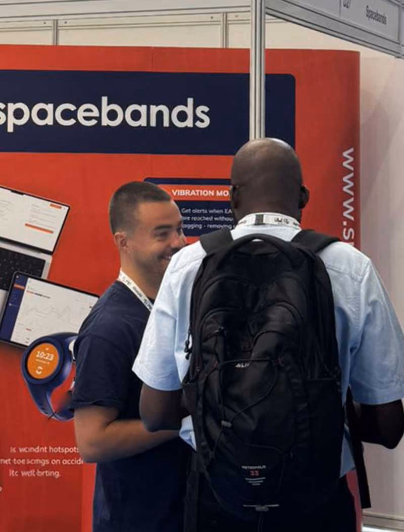 spacebands Co-Founder Ronan Finnegan talking to customer at event
