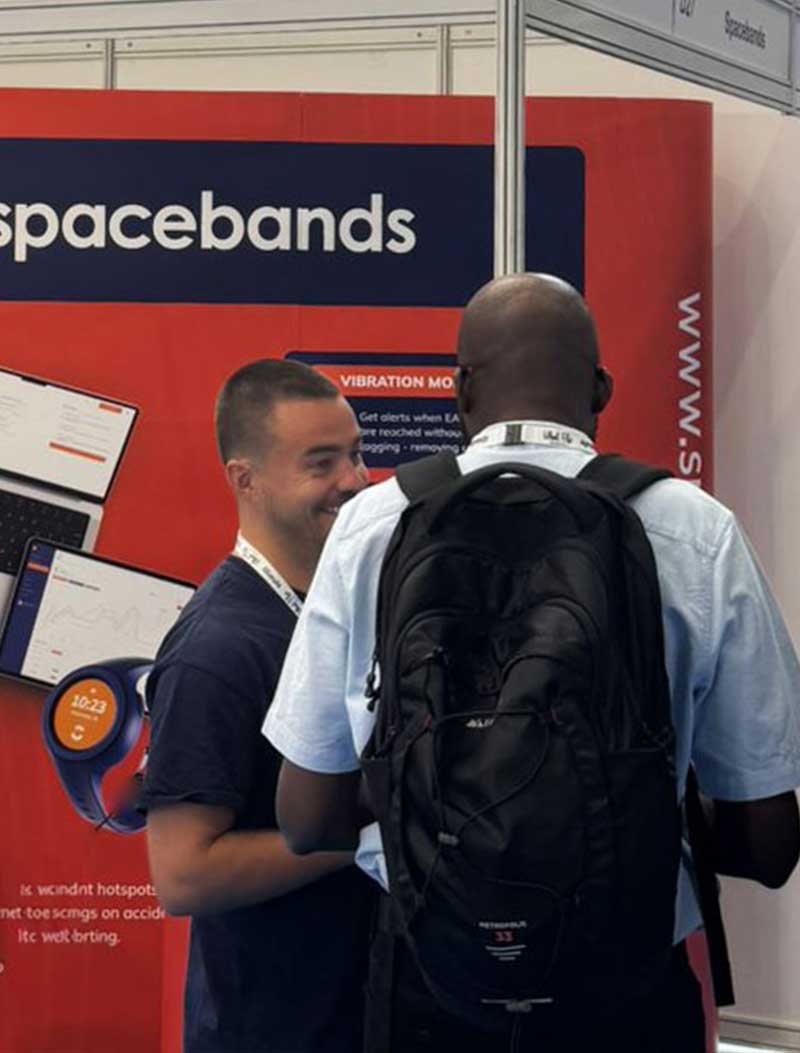 spacebands Co-Founder Ronan Finnegan talking to customer at event