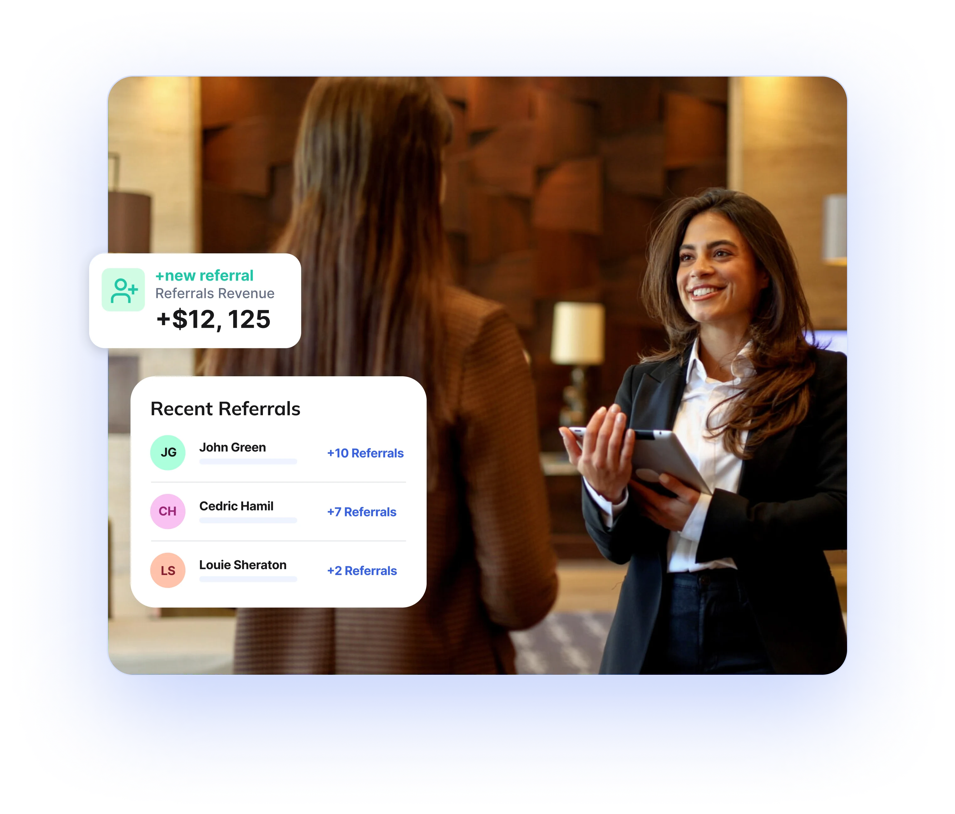 Hotel concierge smiling while speaking with a guest, with dashboard cards showing recent referrals and referral revenue