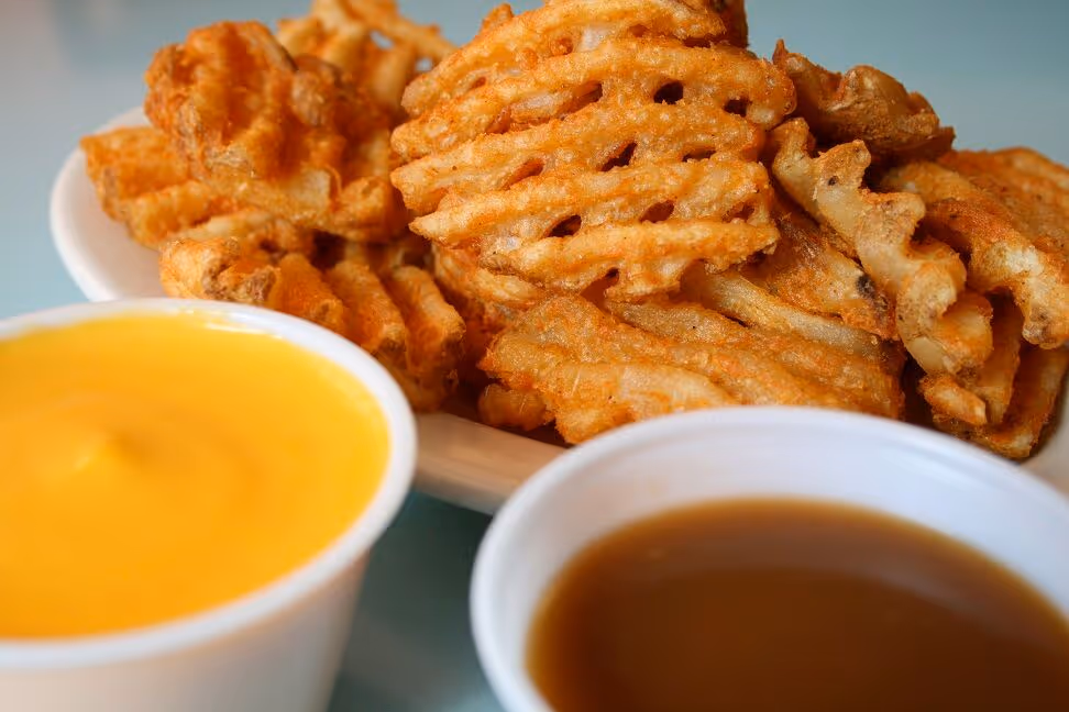 waffle fries and sauce from atomic wings