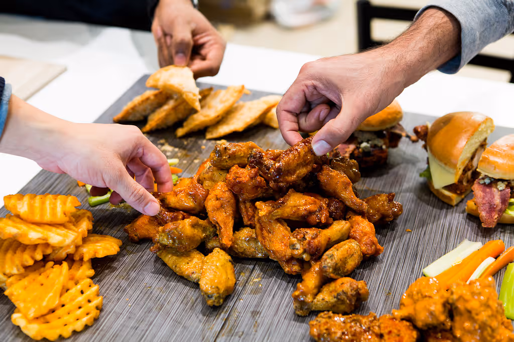 wings, fries, and other food from atomic wings