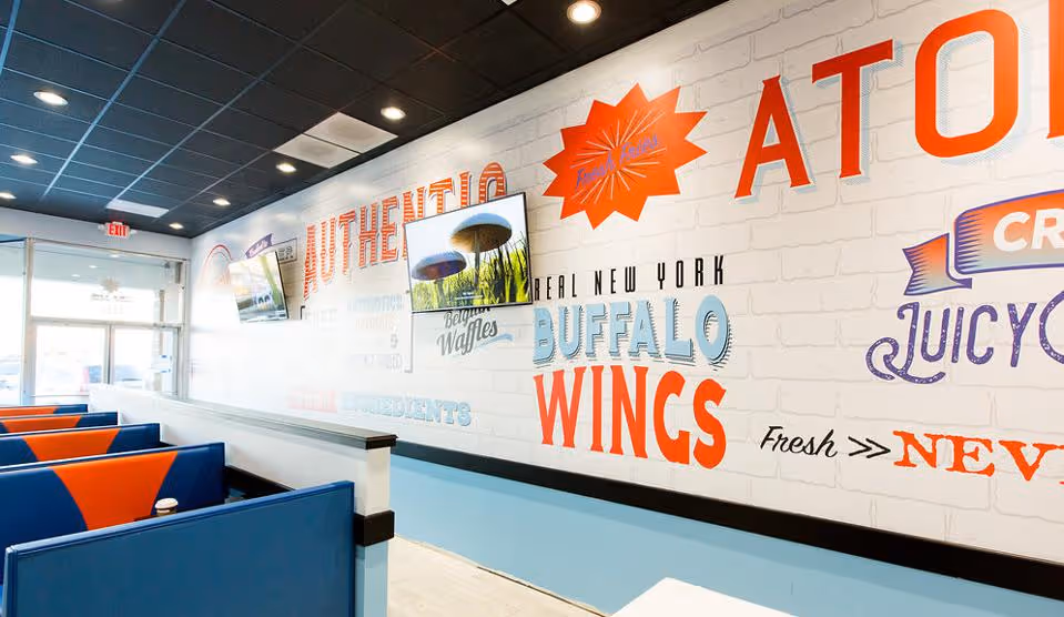 the inside of an atomic wings restaurant
