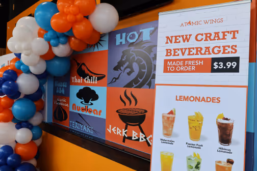 a location of atomic wings, showing the menu inside the shop