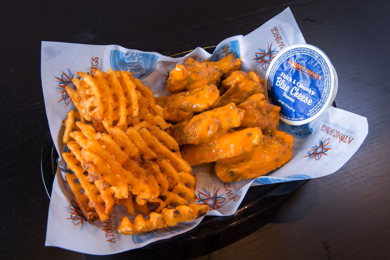 waffle fries and buffalo wings from atomic wings