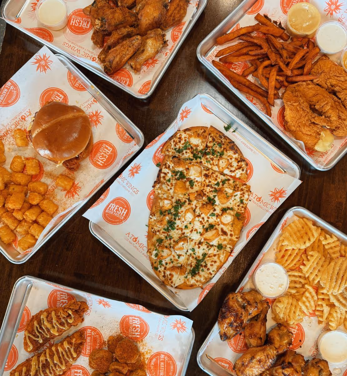 an assortment of food from atomic wings