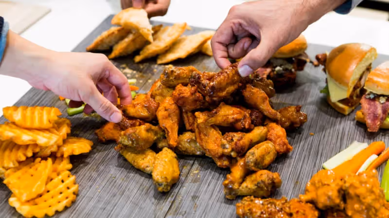 wings, fries, and other food from atomic wings