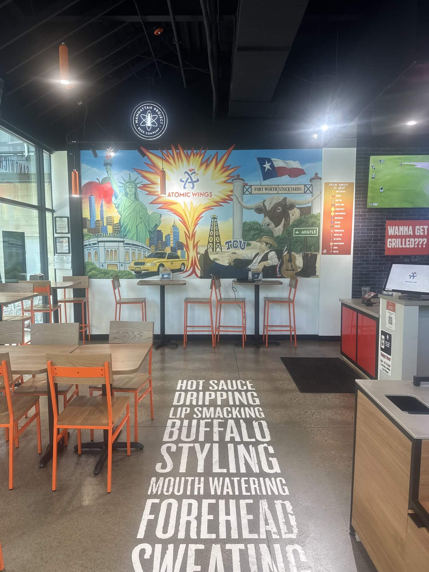 Dining room and Texas mural inside Atomic Wings in the Fort Worth Near Southside