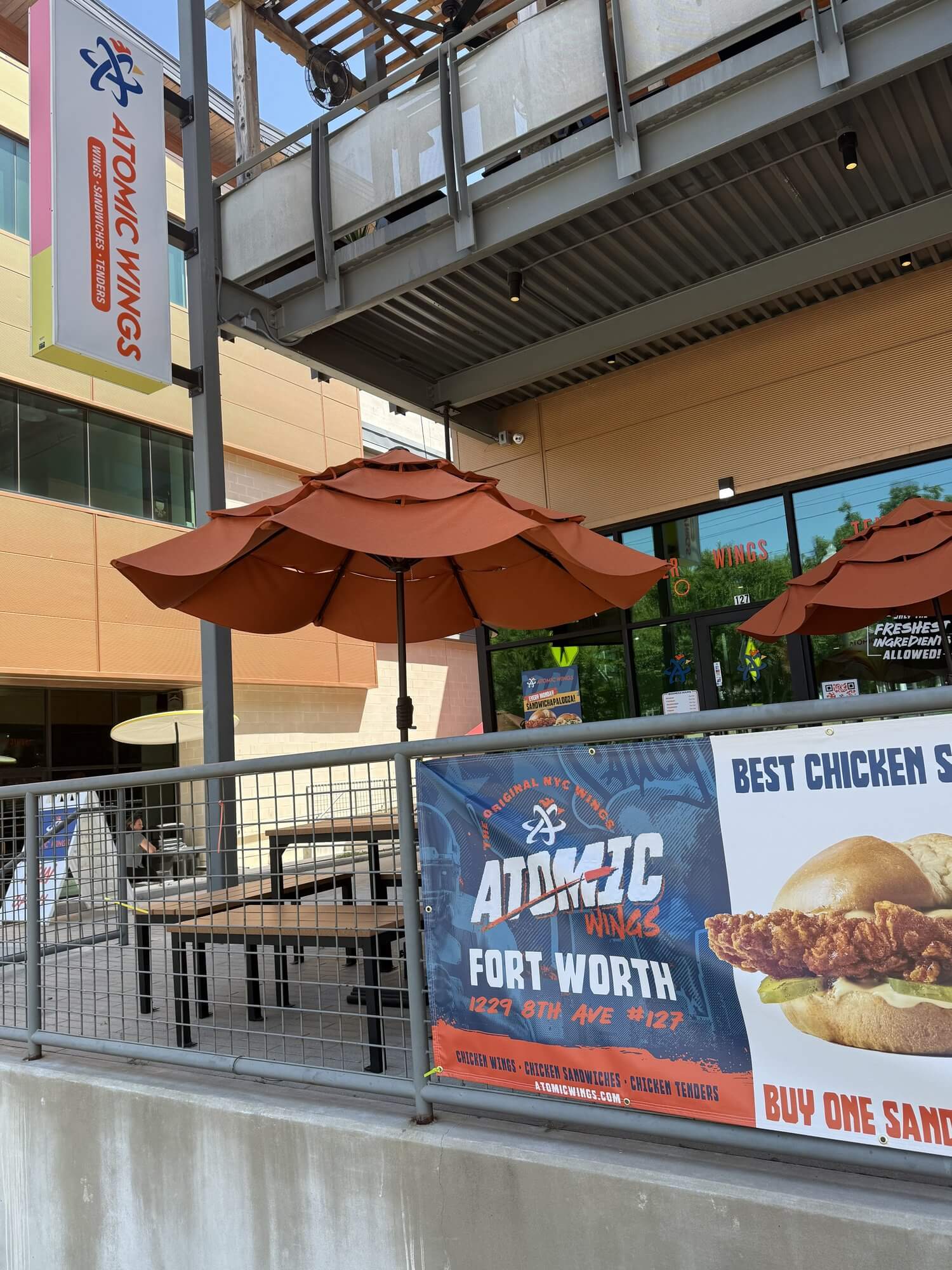 Covered outdoor patio seating at Atomic Wings on 8th Avenue in Fort Worth