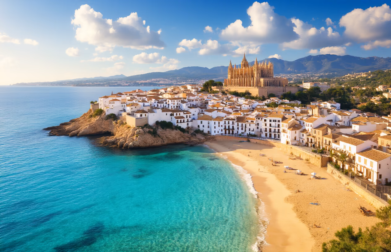 Create a realistic image of a stunning panoramic view of Mallorca showcasing the perfect blend of Mediterranean lifestyle elements: a picturesque coastal scene with turquoise crystal-clear waters and a pristine sandy beach in the foreground, traditional whitewashed Mediterranean village houses with terracotta roofs nestled on hillsides in the middle ground, and the historic cathedral of Palma de Mallorca visible in the distance, all bathed in warm golden hour sunlight with a few scattered puffy white clouds in a brilliant blue sky, capturing the essence of relaxation, culture, and natural beauty that defines the Mallorcan experience. Absolutely NO text should be in the scene.