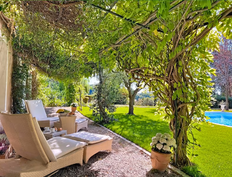 Picturesque villa framed by lush garden