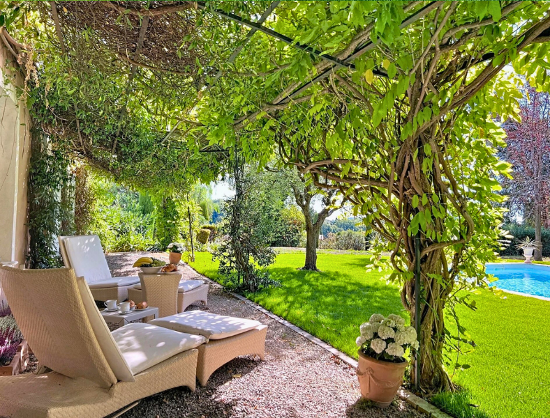 Picturesque villa framed by lush garden