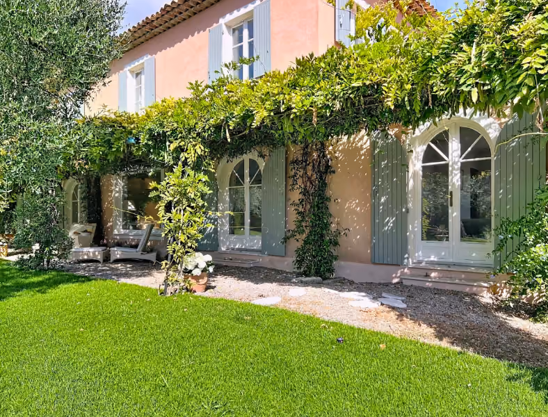 Picturesque villa framed by lush garden